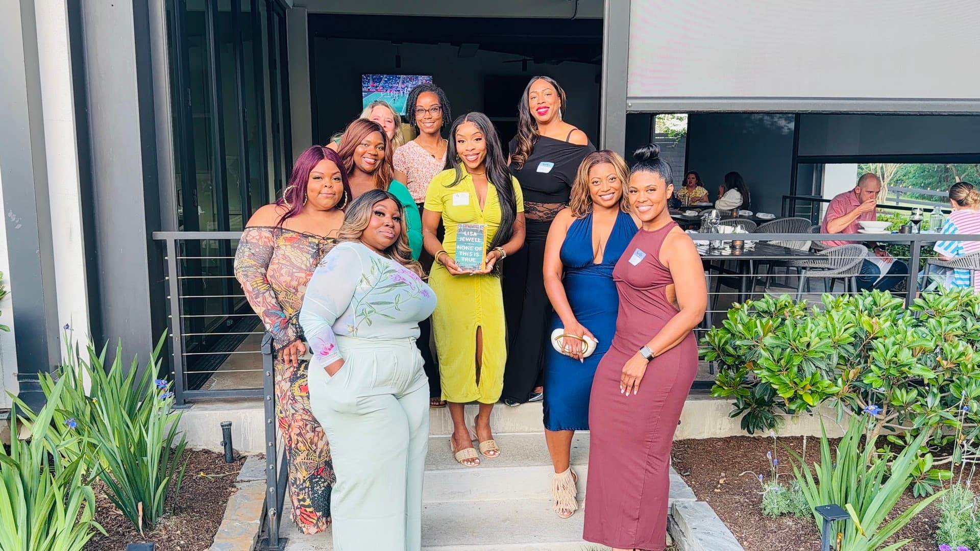 Happy Black women smiling together at a community gathering